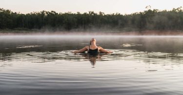 Woman swimming in cold water